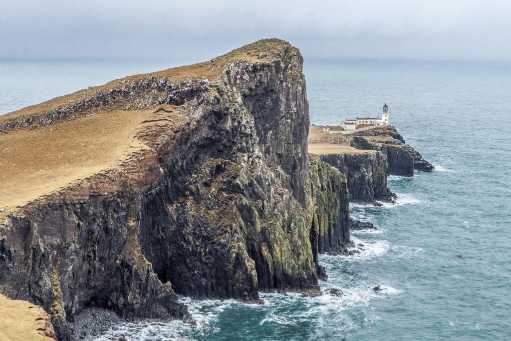 pexels-photo-176383-176383 Dramatic cliffs and the iconic Neist Point Lighthouse on the captivating Isle of Skye coastline in Scotland.